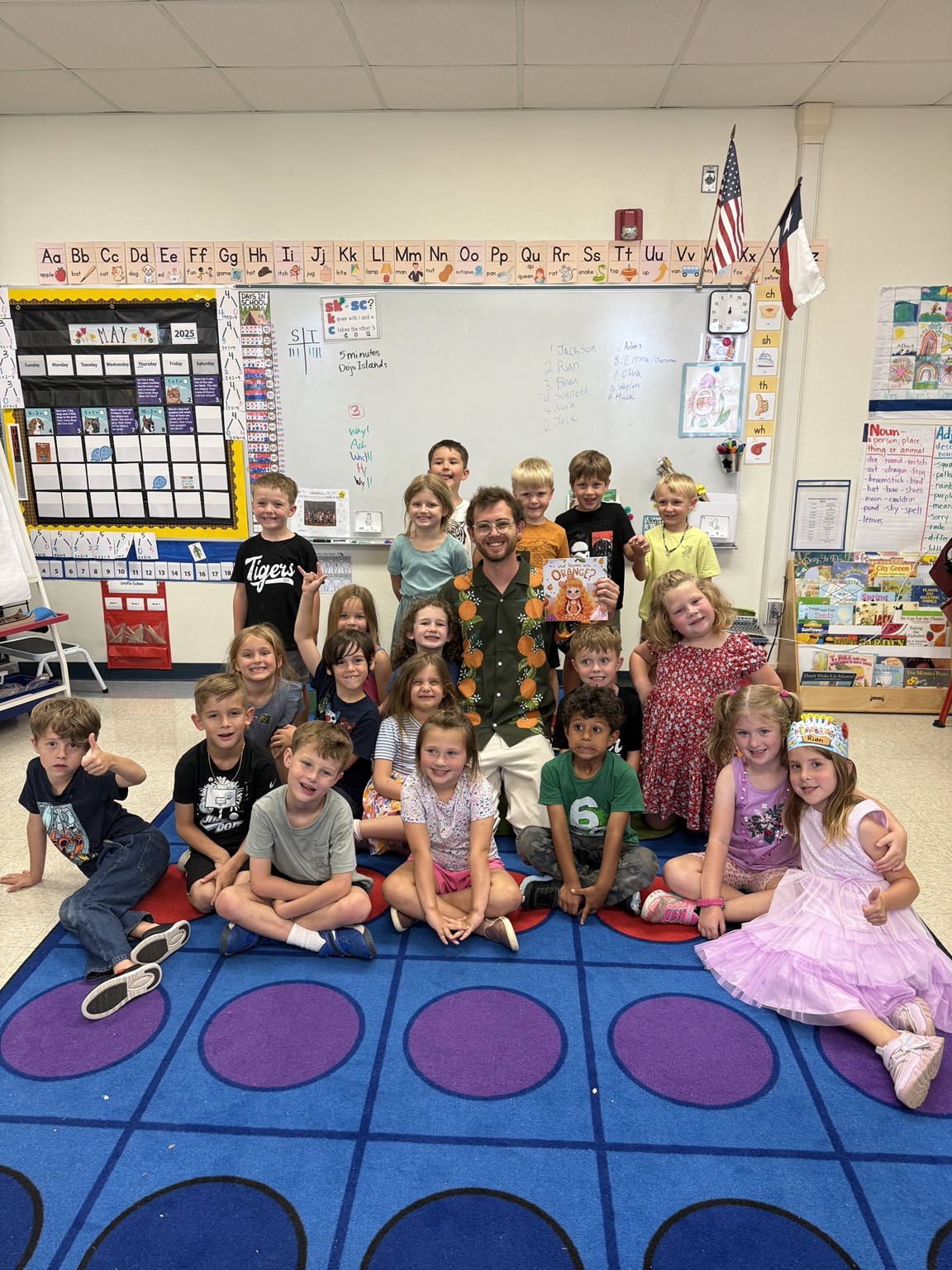 Mr B with students after a What Rhymes With Orange school program