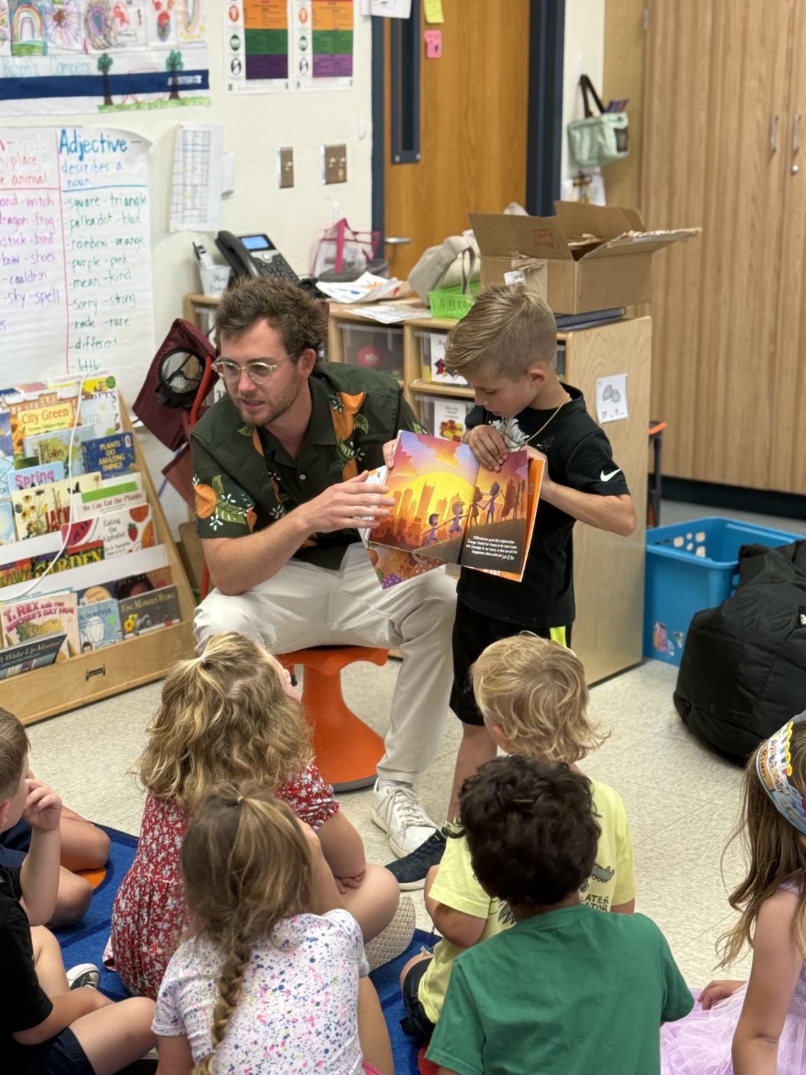 Mr B reading What Rhymes With Orange to children in a classroom